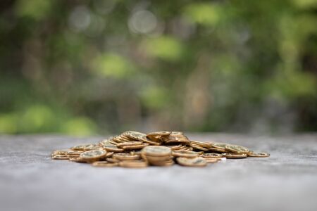 Money Financial Business Growth concept. Pile of gold coins with nature backgroundの写真素材