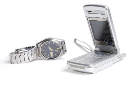 Composition with cellphone and watch over white backgroundの写真素材