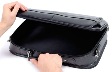 Male hands opening black briefcase over white background
