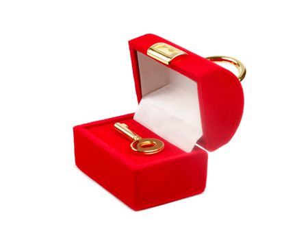 Decorative red box with golden key isolated over white background