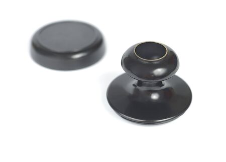 Black stamp with lid isolated over whiteの写真素材