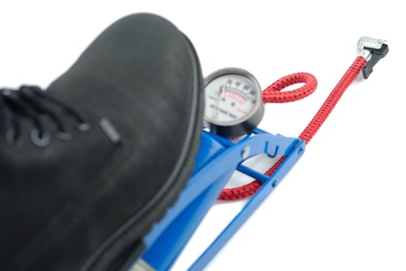 Big boot pressing air pump isolated on white backgroundの写真素材
