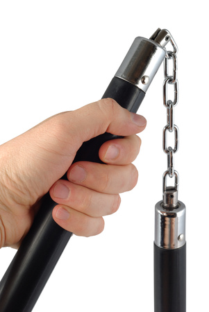 Male hand with nunchaku isolated over white background  Clipping path included の写真素材
