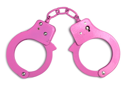 Pink decorative handcuffs isolated with clipping paths over white backgroundの写真素材