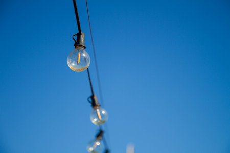A string of light bulbs and blue sky in Penghu, Taiwan.