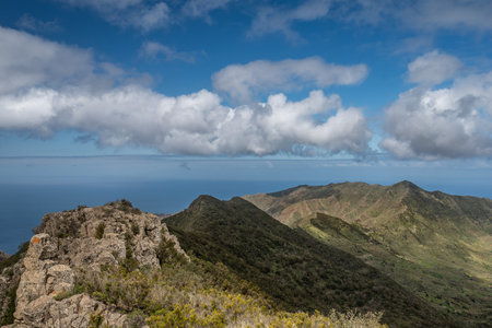 Summer landscape of green mountains and blue skyの写真素材