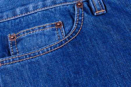 The delayed pocket of dark blue jeans a backgroundの写真素材