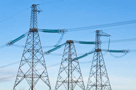 High-voltage line against the blue sky