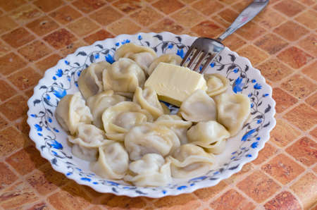Pelmeni ravioli  in a plate on a tableの写真素材
