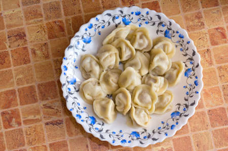 Pelmeni ravioli  in a plate on a tableの写真素材