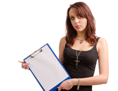 Modern young female student with a clipboard with a blank sheet of white paper held at an angle to the side, studio portrait isolated on whiteの写真素材