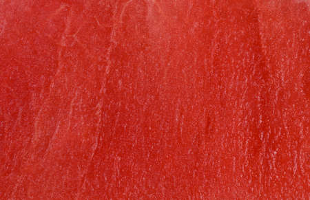 Background texture of a fresh juicy pink watermelon for a refreshing summer snackの写真素材