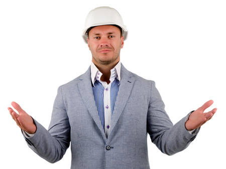 Close up Middle Age Male Engineer in Gray Coat and White Helmet Looking with Open Hands Palms Facing Upward at Cameraの写真素材