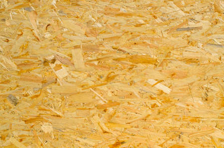 Background texture and pattern of new chipboard ready to be installed at a building site showing the...