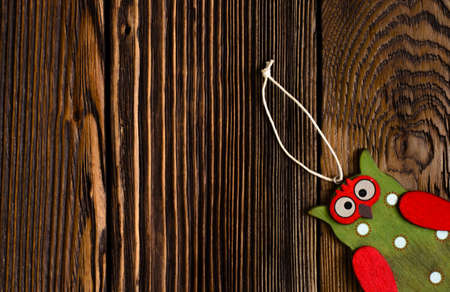 Close up Owl Tag on Top of Textured Wooden Platform. Emphasizing Copy Space.の写真素材
