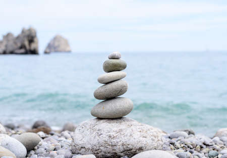 Close up Conceptual Piled Stones with Different Sizes at the Beach, Emphasizing Perfect Balanceの写真素材