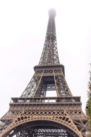 Low angle view of the Eiffel Tower, Paris, France looking up to the top as it disappears into the mistの写真素材