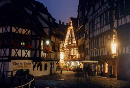 France, Strasbug - October 29, 2015: Night Street in the Old City, home lighting, lonely passers