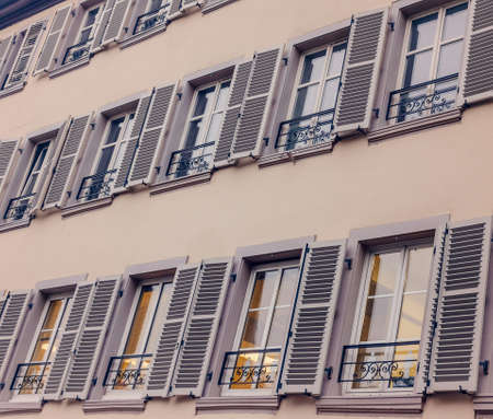French rustic windows with shutters rural house, Franceの写真素材