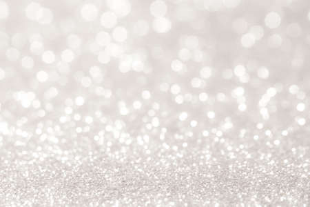 silver and white bokeh lights defocused. abstract background silver and white bokeh lights defocused. abstract background