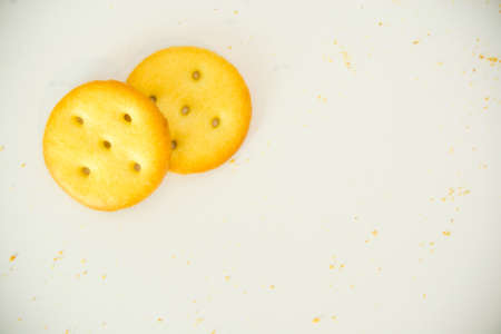 Gold cracker and chip biscuits on white background with copy space use for background - special effectの写真素材