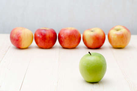 Green apple, red apple think different concept or Leadership conceptの写真素材