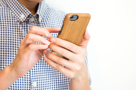 young playing smartphone - vintage effectの写真素材