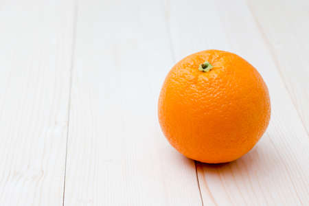 orange fruit on wooden background