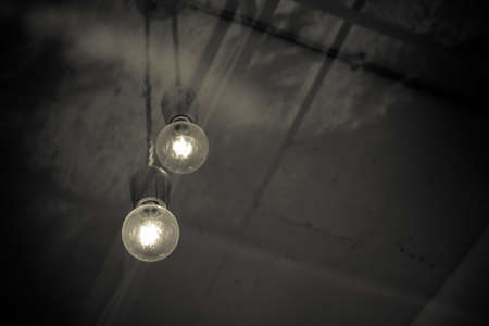 Take the bulb in the coffee shop through glass - vintage style effect pictureの写真素材