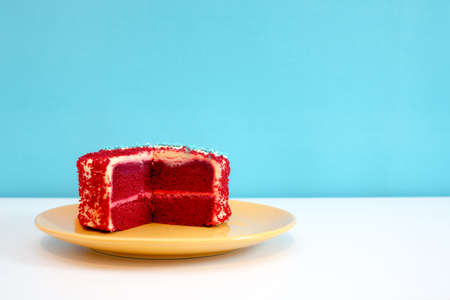 Red velvet cake on white table and blue backgroundの写真素材