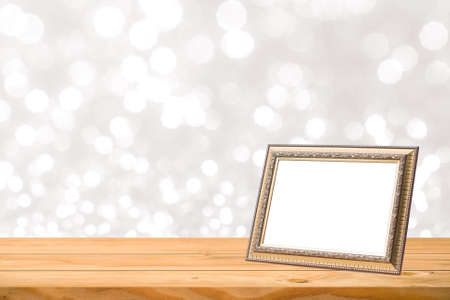Photo frame on wood table blur backgroundの写真素材