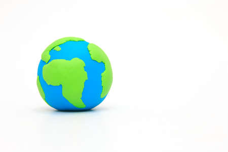 Globe ,earth made from clay on white background with copy space. Concept Save green planet.の写真素材