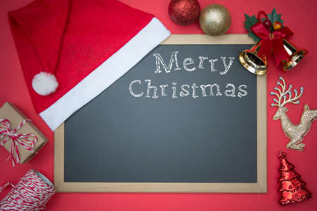Blackboard With Red Santa Hat And Christmas Decoration. English Text Merry Christmasの写真素材
