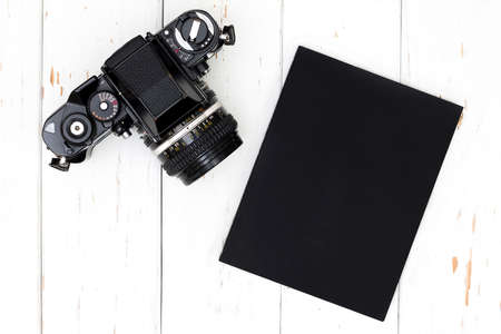 Top view of old camera and book.の写真素材