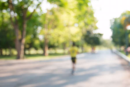 blurred backgrounds of people exercise at parks outdoor:blur of people running,walking,jogging at...