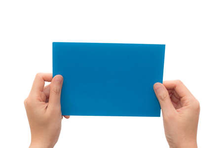 Human hand hold virtual business card, credit card or blank paper isolated on white background. This picture has clipping path for easy to use.の写真素材