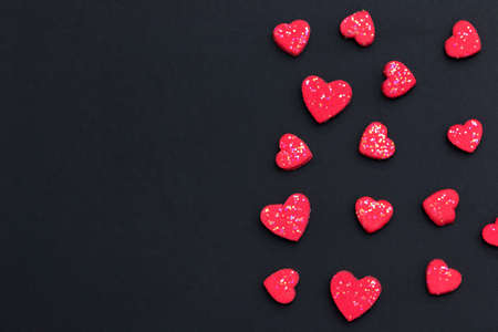 Red heart on black background with copy space for greeting card. Valentine's day background concept....