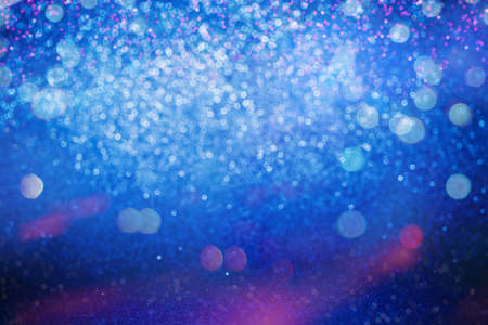 Glitter abstract background. Blue and Pink bokeh lights defocused.の写真素材