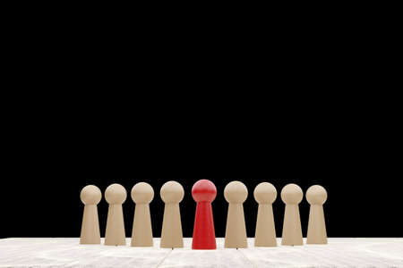 Wooden figure standing on the table black background with copy space. Concept of business leadership for leader team, successful competition winner and Leader with influence. 3D illustration renderingの写真素材