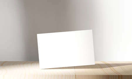 Blank business cards mockup on wooden table. Sunny shadow on wall background. 3D illustration rendering.の写真素材
