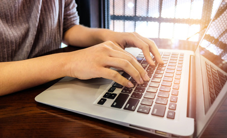 Woman office worker is typing keyboardの写真素材