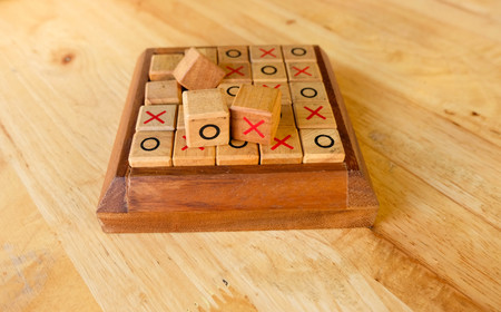right or wrong with tic tac toe game on the wood tableの写真素材