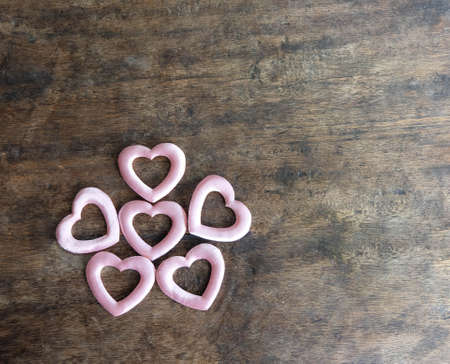 Valentines day pink heart on wooden background, love conceptの写真素材