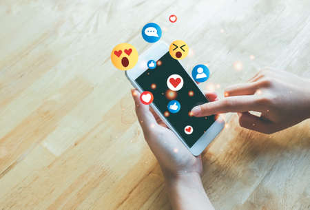 Concept of using digital media, technology, social media online surfing, woman's hand using...