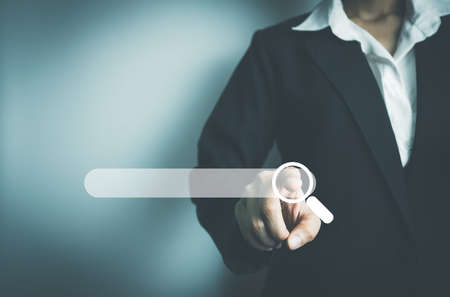 Search Engine optimization SEO concept, Businesswoman search for information on Internet, Using the search bar, Wireless Network, big data and accessing website information.の写真素材