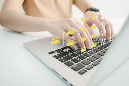 Officer using laptop manage files, Document Management System (DMS), Online document database management, automated processes to manage system, ERP enterprise efficient, business technology.の写真素材