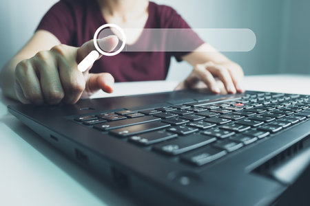 SEO Search engine optimization, Search technology, women's hands using a computer keyboard to search for information, using websites search bar to find the desired information or shopping online.の写真素材