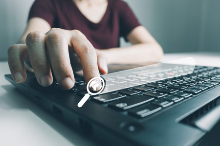 SEO Search engine optimization, Search technology, women's hands using a computer keyboard to search for information, using websites search bar to find the desired information or shopping online.の写真素材