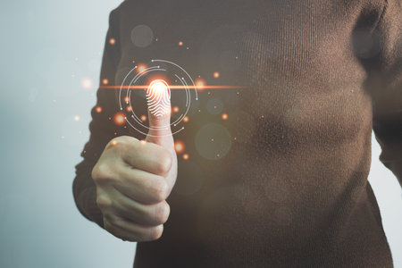 Person touching screen to fingerprint scanner, security access information, big data management concept, Internet of things, cloud computing, internet connection, shopping online and cashless society.の写真素材
