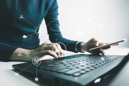 Concept global data connection with internet technology, users are using labtop for online transactions by internet technology, big data, database management, cloud computing, cashless society.の写真素材